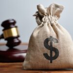 Dollar Bag & Judge's Gavel. Concept of Maximizing Settlement & Compensation