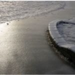 A curved icy covered walking path.