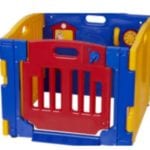 A standing red, blue and yellow square plastic toddler sized play yard.