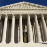 Looking up at the The United States Supreme Court building from the front steps.