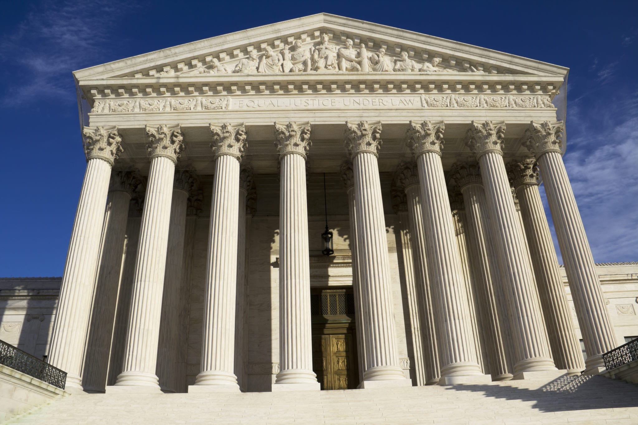 Looking up at the The United States Supreme Court building from the front steps.