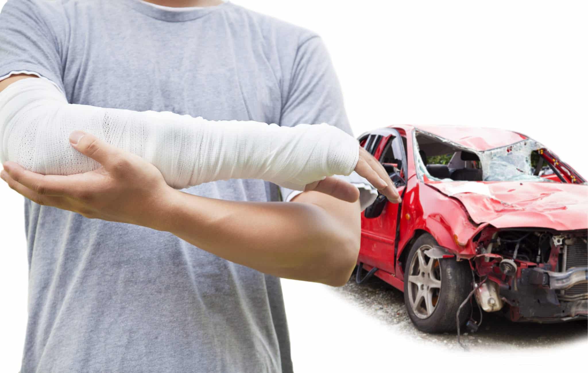 Injured person with cast on arm standing in front of a severely damaged red car.