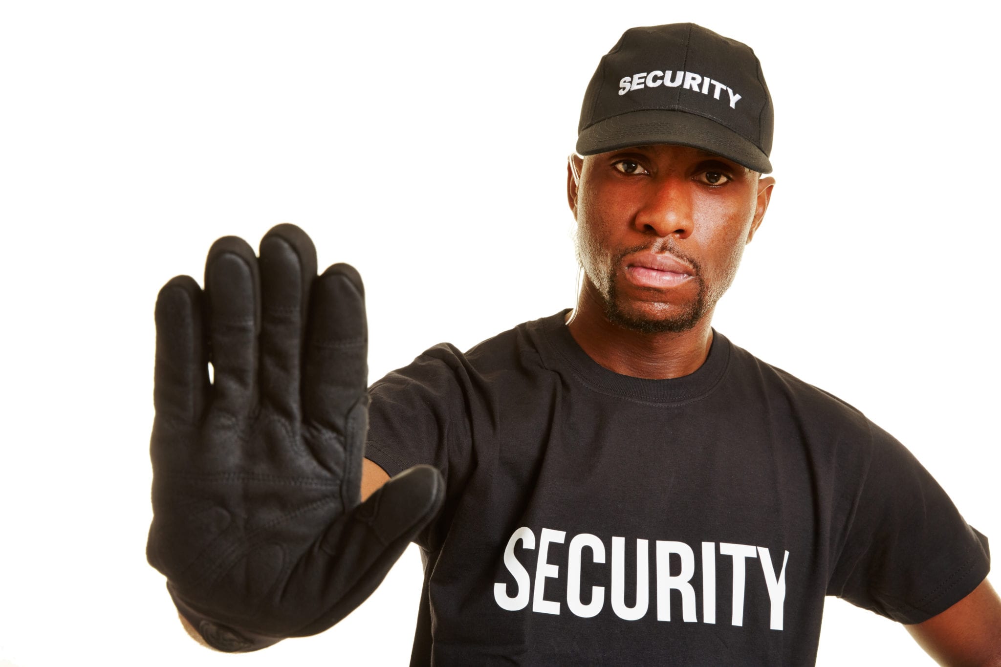 A white background with a man wearing a black t-shirt and hat with the word SECURITY written across both, a black glove on his right hand that he is holding up to indicate stop to anyone approaching.