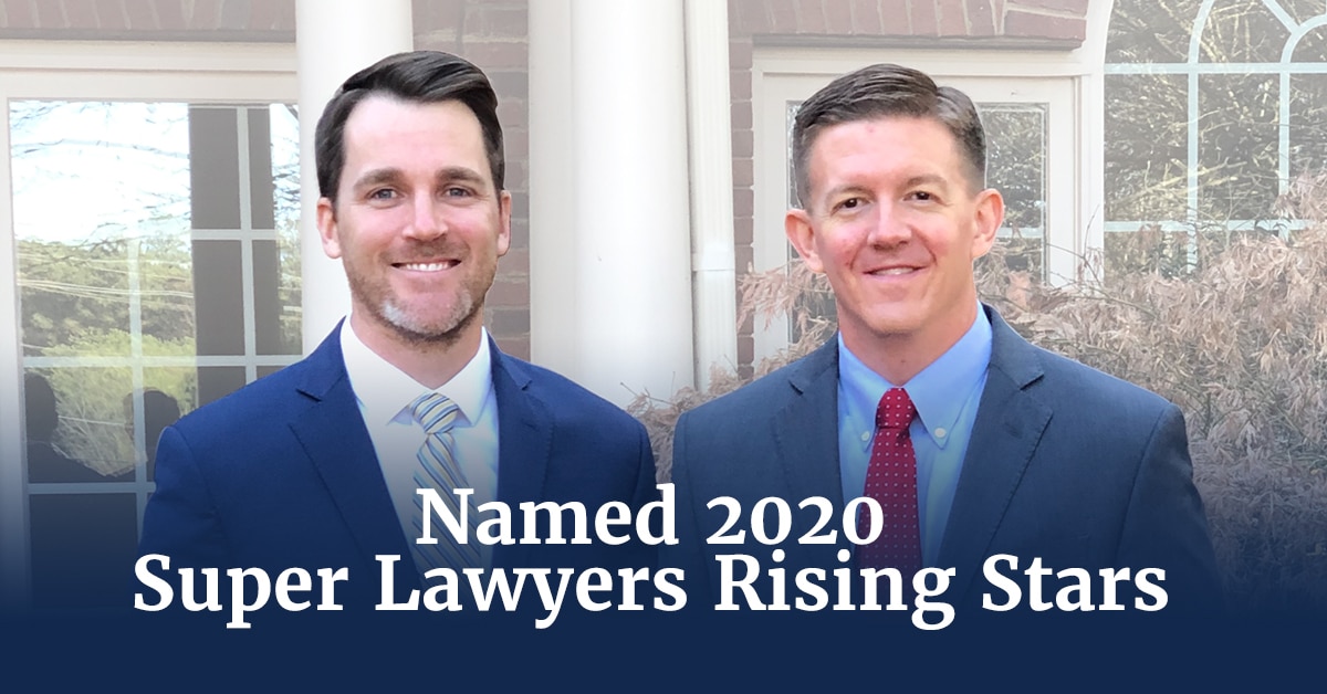 Two proffesional males standing beside each other in front of an office building with the words Named 2020 Super Lawyers Rising Stars.