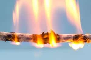 A closeup of a rope on fire.