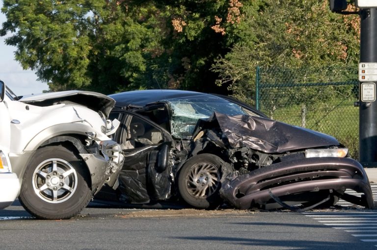 A two vehicle motor vehicle accident with police on scene.