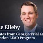 A headshot of a professional male behinf the caption Chase Elleby graduates from georgia Trial Lawyers association LEAD Program.