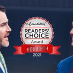 Two adult males conversing with a 2021 readers choice award label between the two of them.