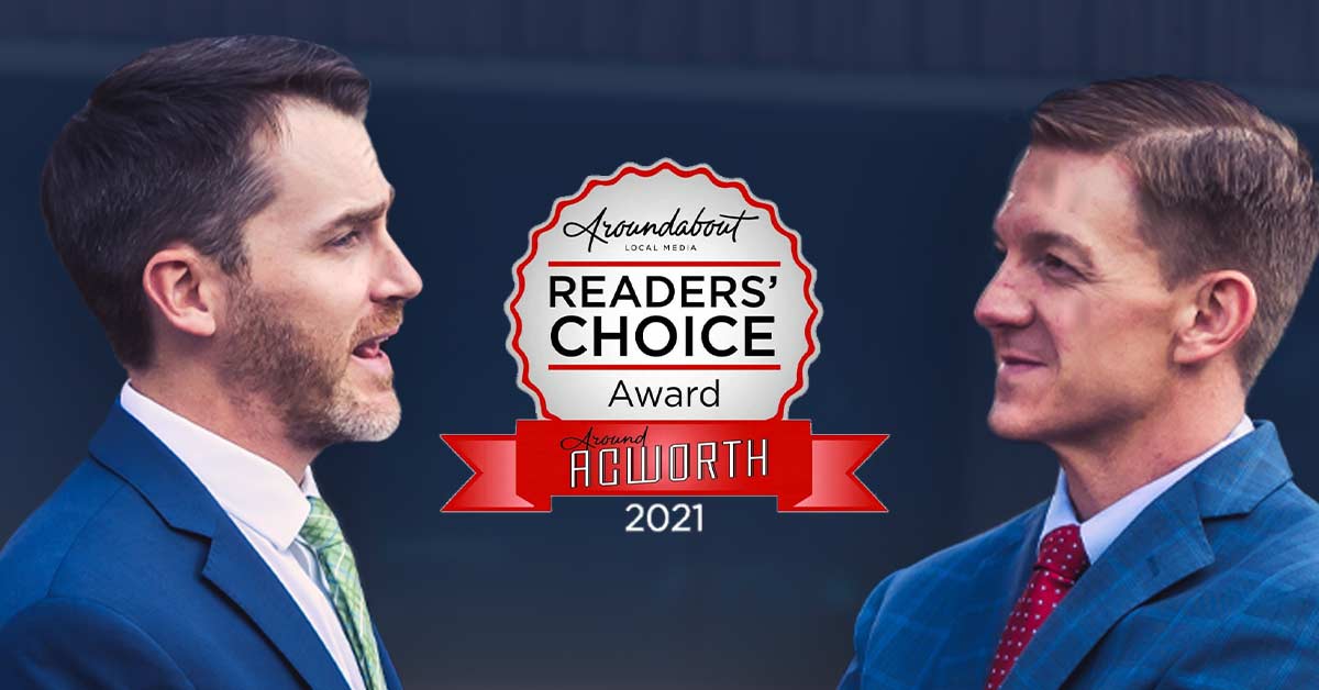 Two adult males conversing with a 2021 readers choice award label between the two of them.