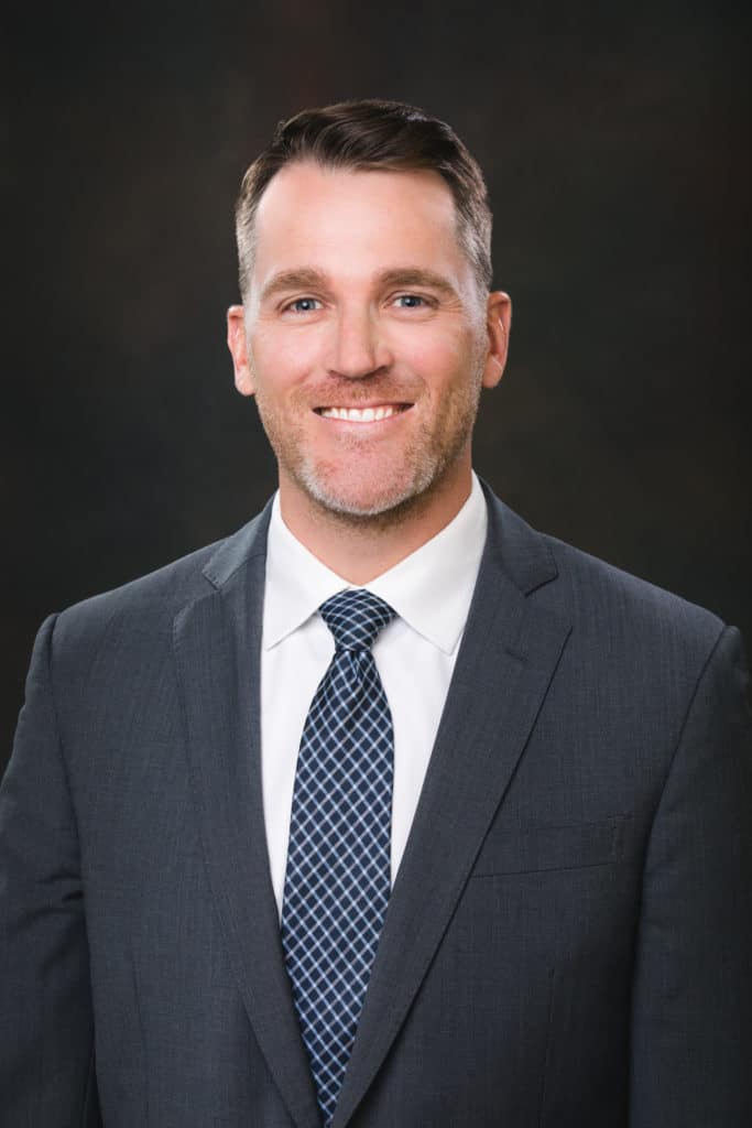 A headshot of a male professional.