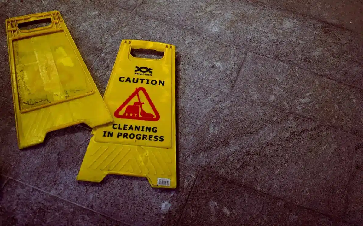 Yellow caution sign of cleaning in progress on floor