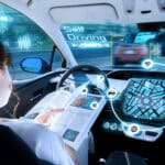 young woman reading a magazine in a autonomous car. driverless car. self-driving vehicle. heads up display. automotive technology.