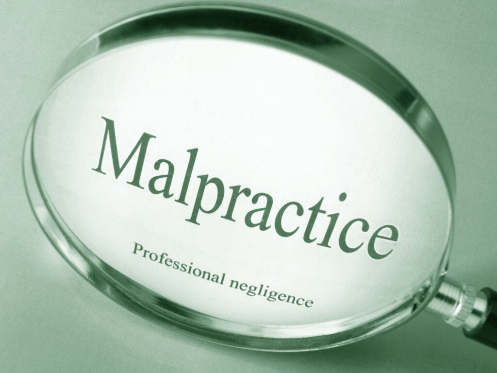 Words in magnifying glass -Malpractice Professional negligence