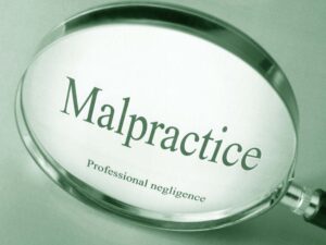 Words in magnifying glass -Malpractice Professional negligence