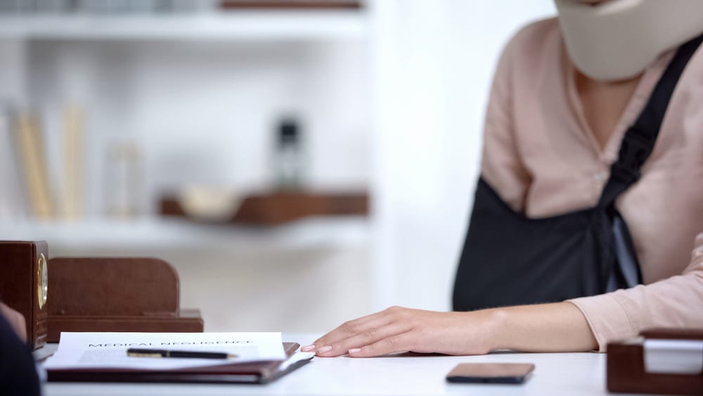 Insurance agent explaining refusal to pay compensation to accident victim, showing denial of insurance claim.