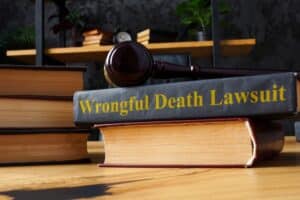 "Pile of law books with text Wrongful Death Lawsuit, legal concept of wrongful death claims